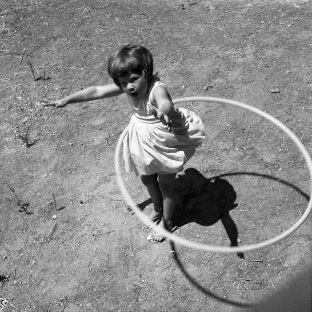 Girl child hula hoop 2022 wikimedia 640px-Girl_twirling_Hula_Hoop,_1958