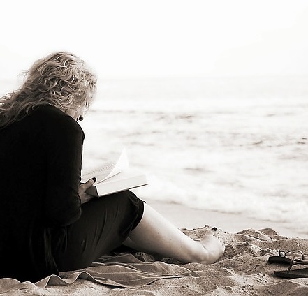 Reader on the beach 2017 pixabay ocean sea blue water cropped